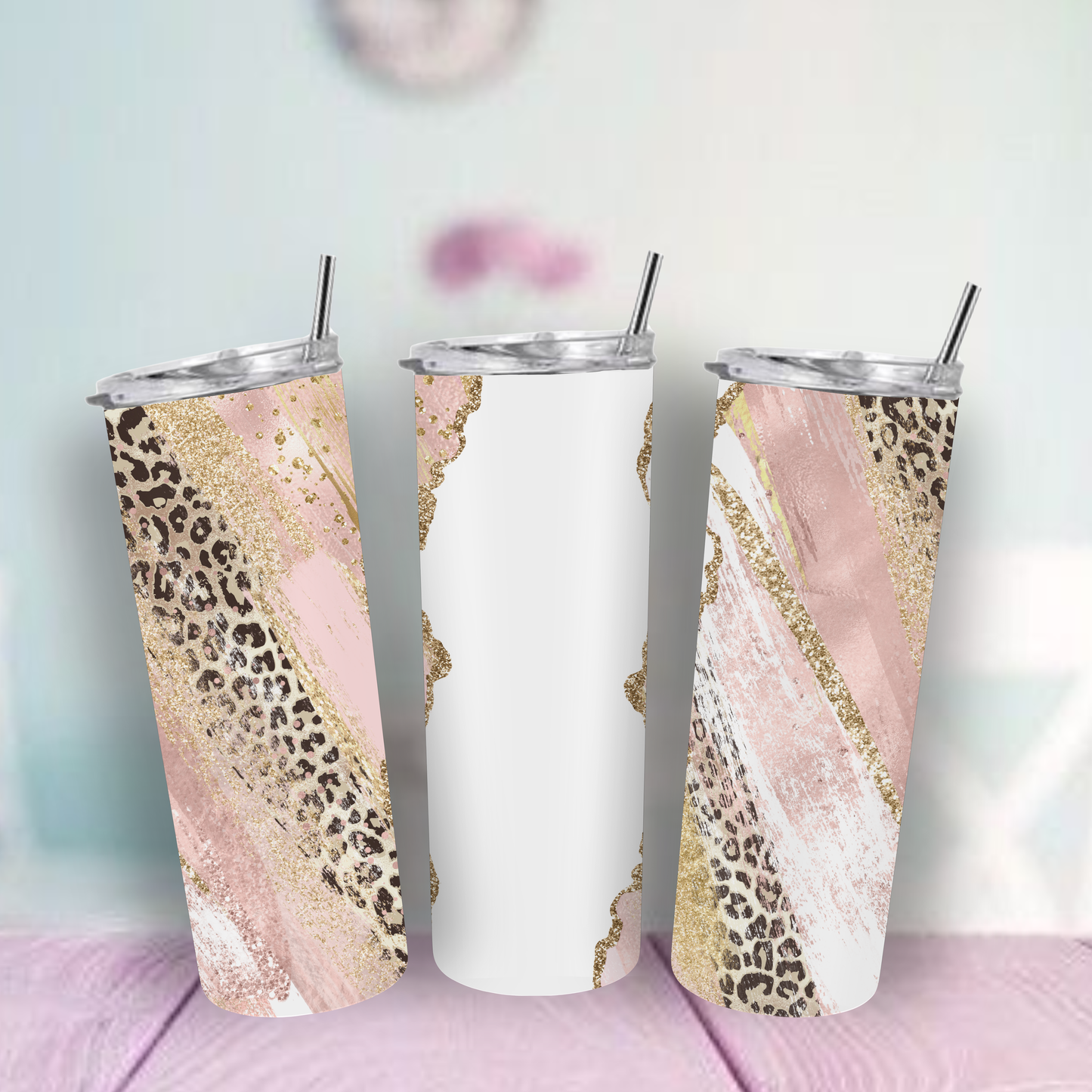Insulated Tumbler with leopard print and marble design on a pink surface.