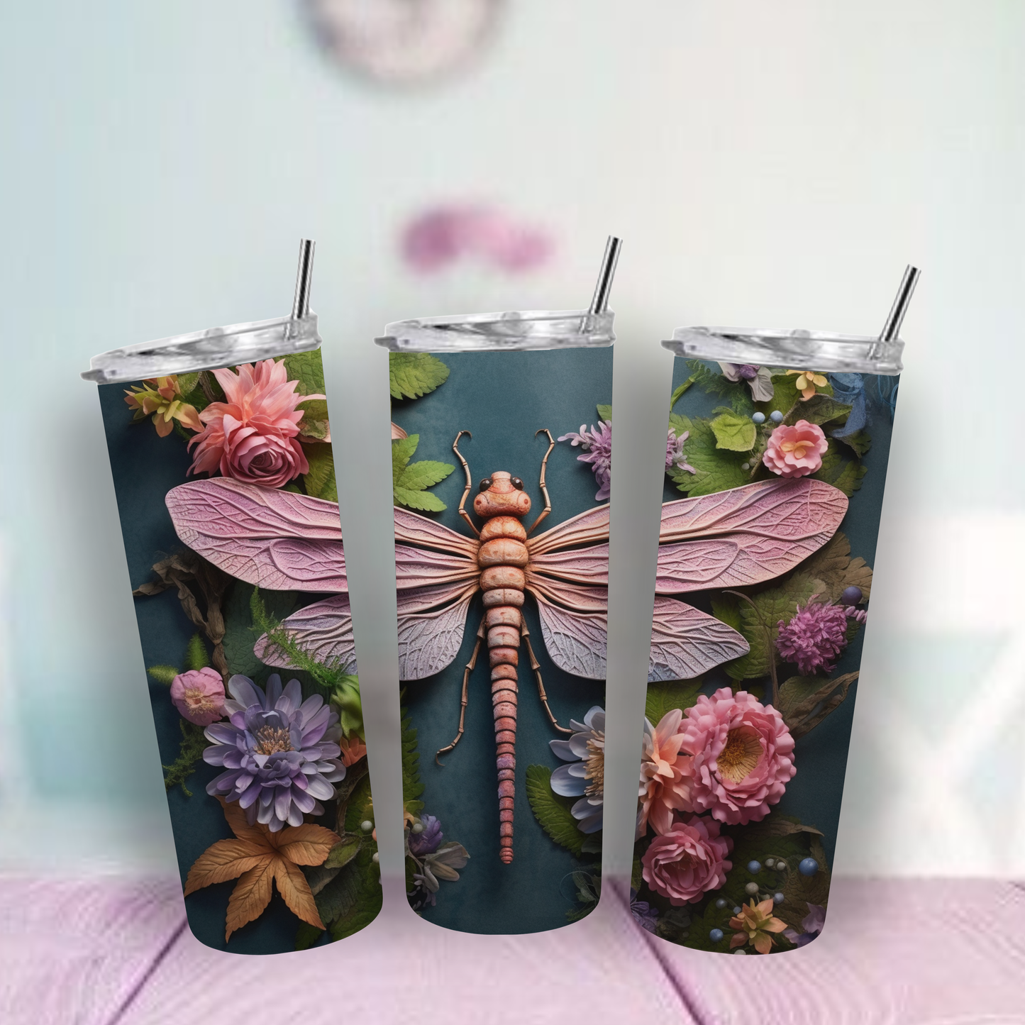 Tumbler with dragonfly and floral design.